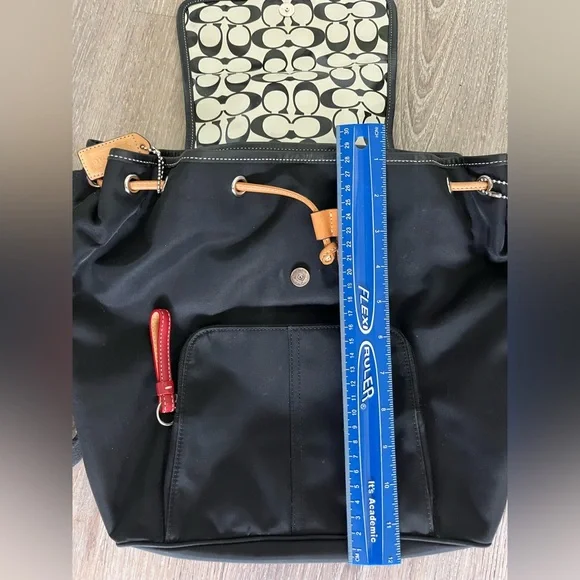 COACH canvas backpack and COACH leather wallet.